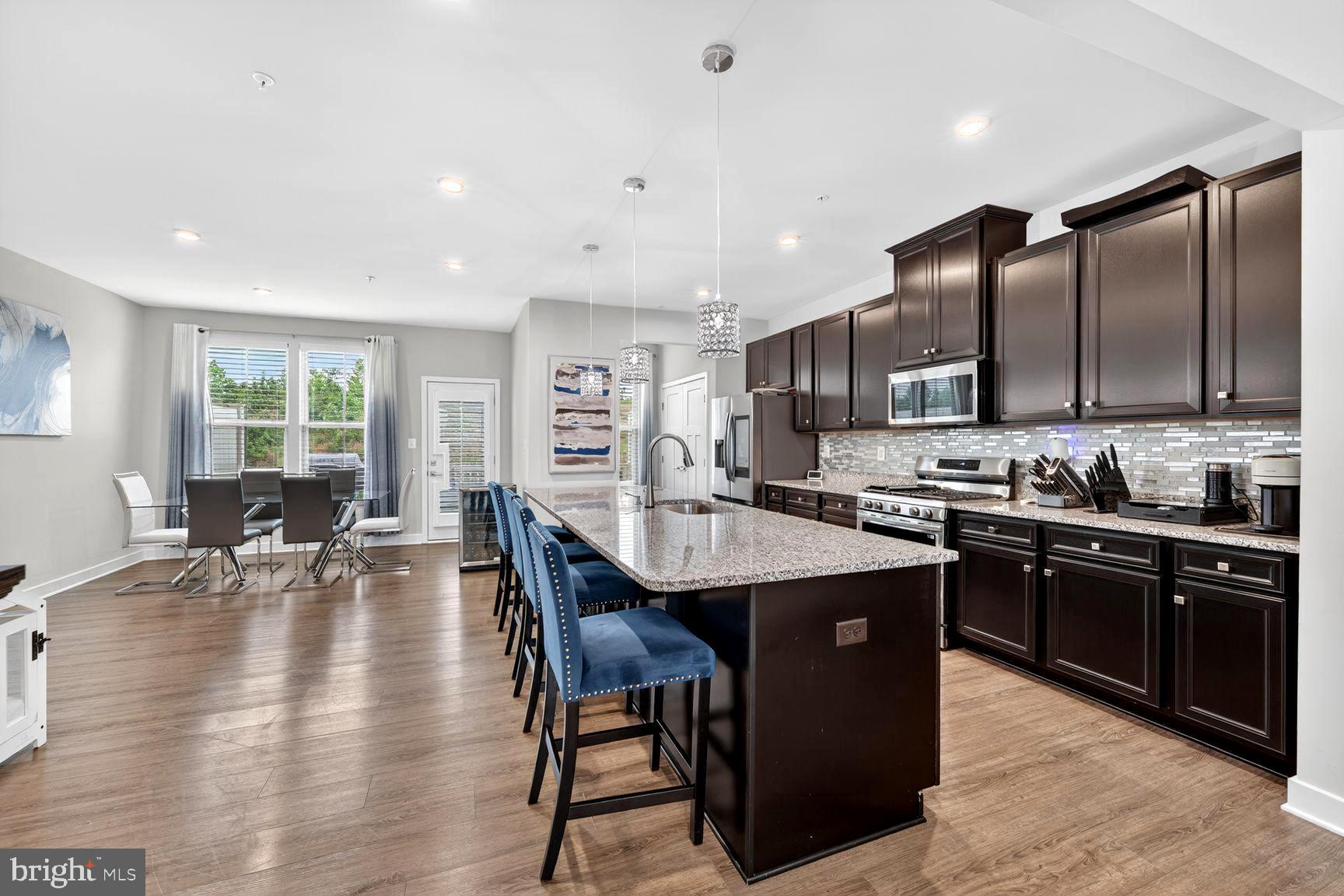 14963 Ring House Road, Unit D Brandywine, MD 20613 - Photo 9 of 31 KITCHEN ISLAND BOASTS OF ARTISTRY IN MOTION