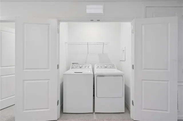 a utility room with dryer and washer