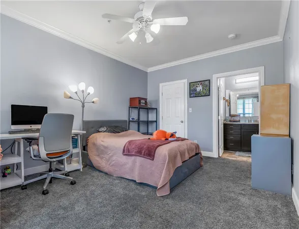 a bed room with a bed and a chair