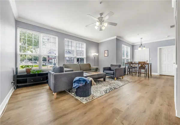 a living room with furniture and a large window