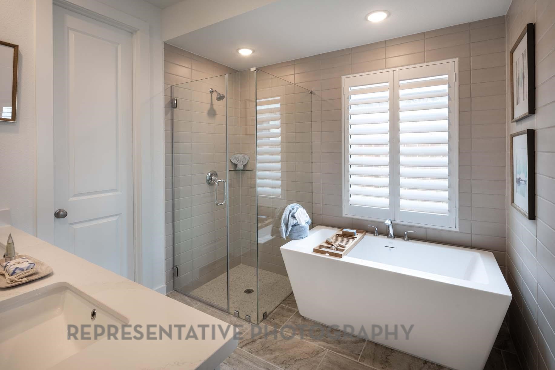 2426 Guava Hls Lane Manvel, TX 77578 - Photo 18 of 48 a white bath tub sitting in a bathroom next to a window