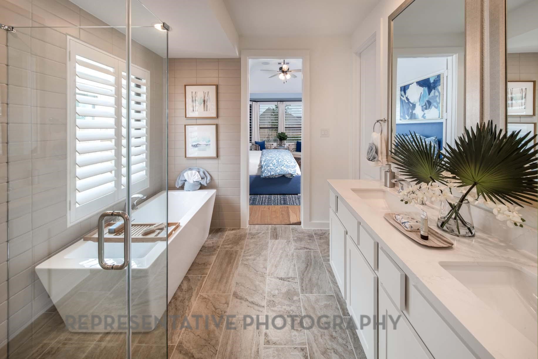 2426 Guava Hls Lane Manvel, TX 77578 - Photo 19 of 48 a spacious bathroom with a tub sink and mirror