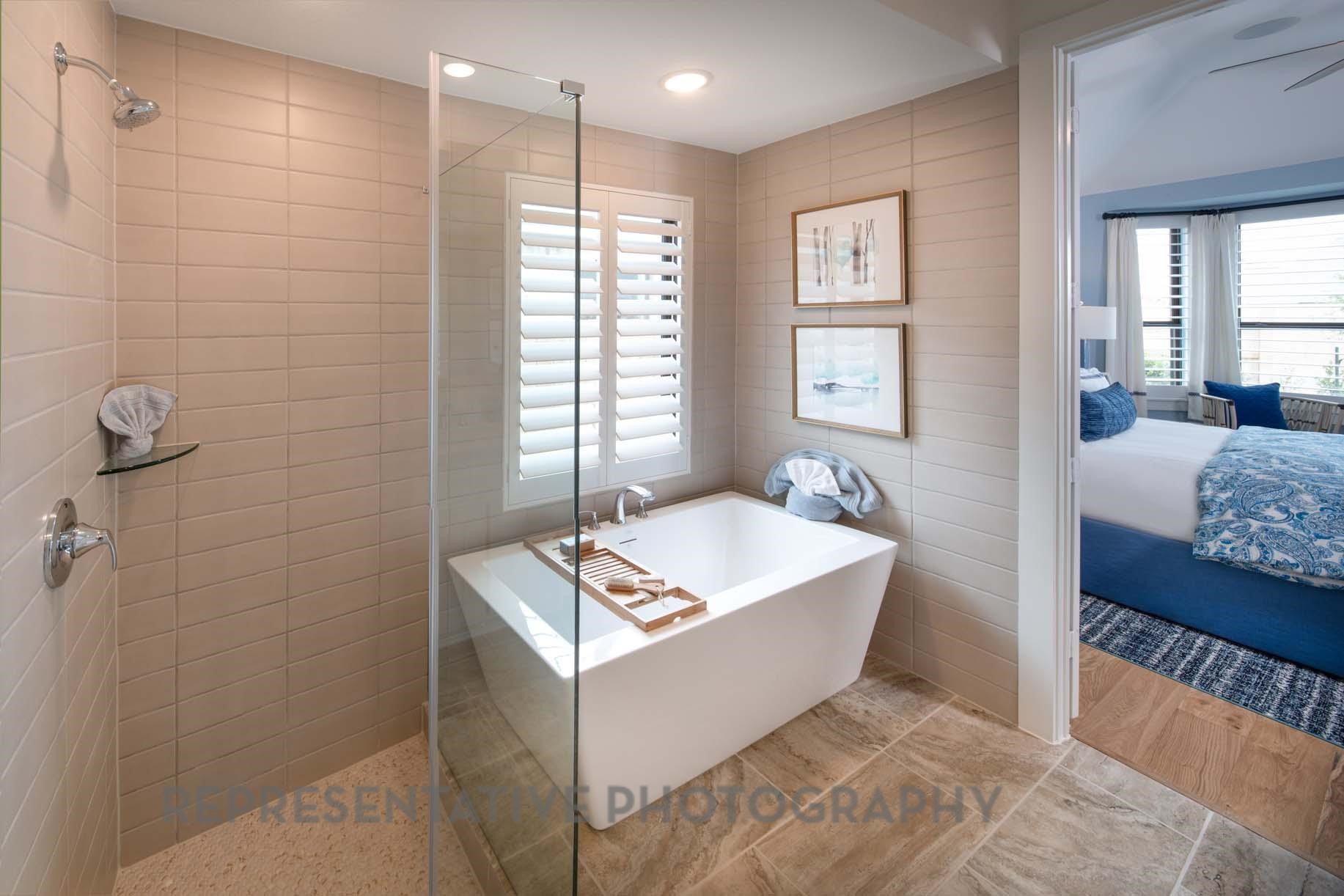 2426 Guava Hls Lane Manvel, TX 77578 - Photo 20 of 48 a spacious bathroom with a tub sink and mirror