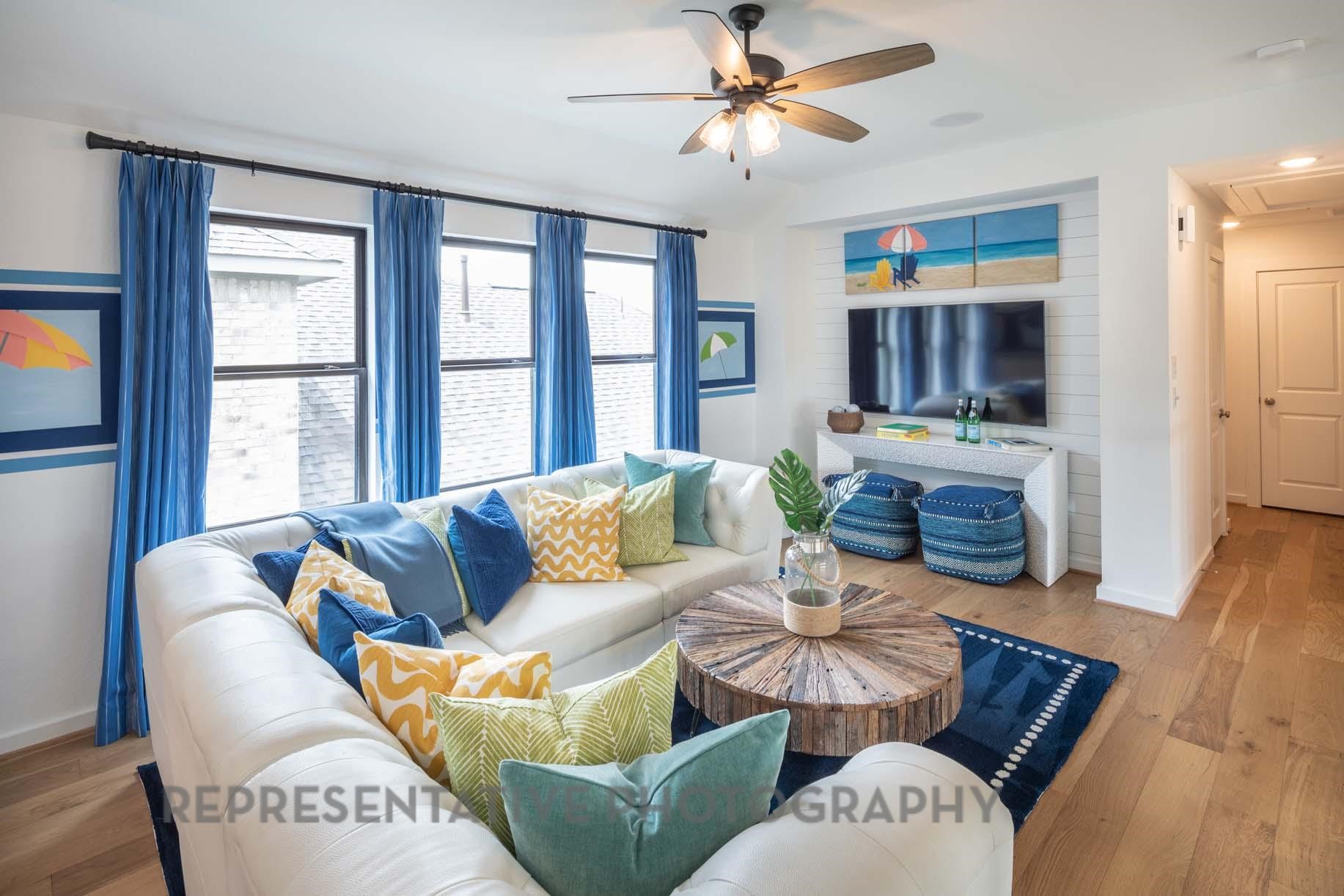 2426 Guava Hls Lane Manvel, TX 77578 - Photo 30 of 48 a living room with furniture a fireplace and a large window