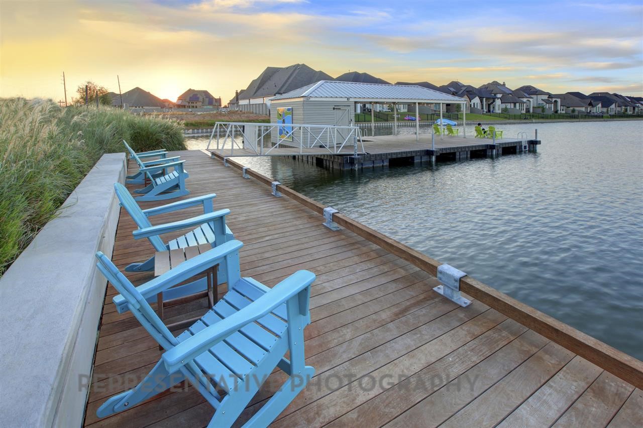 2426 Guava Hls Lane Manvel, TX 77578 - Photo 48 of 48 a view of a lake with a mountain from a balcony