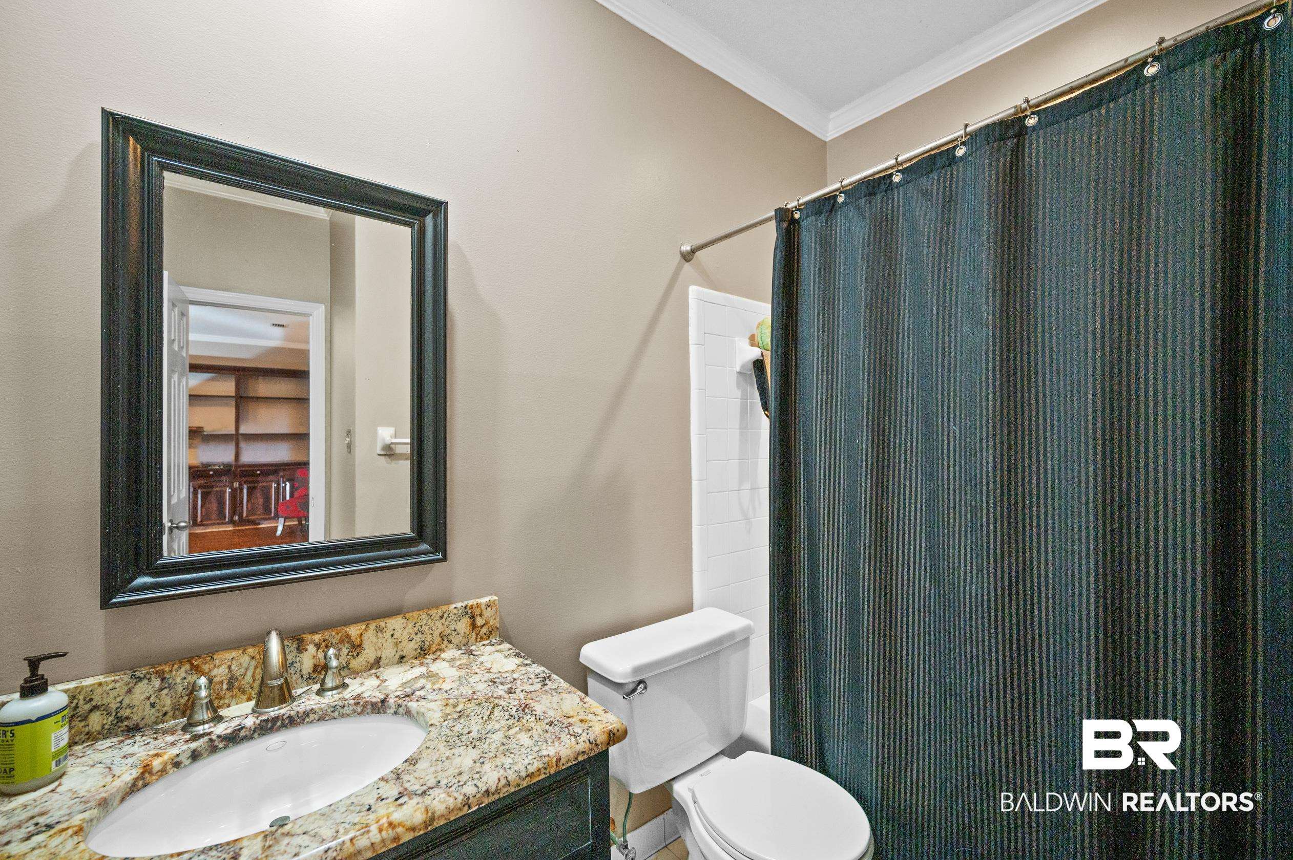 6705 Ridgeland Road South Mobile, AL 36695 - Photo 17 of 44 Bathroom with toilet, ornamental molding, vanity, and a shower with shower curtain