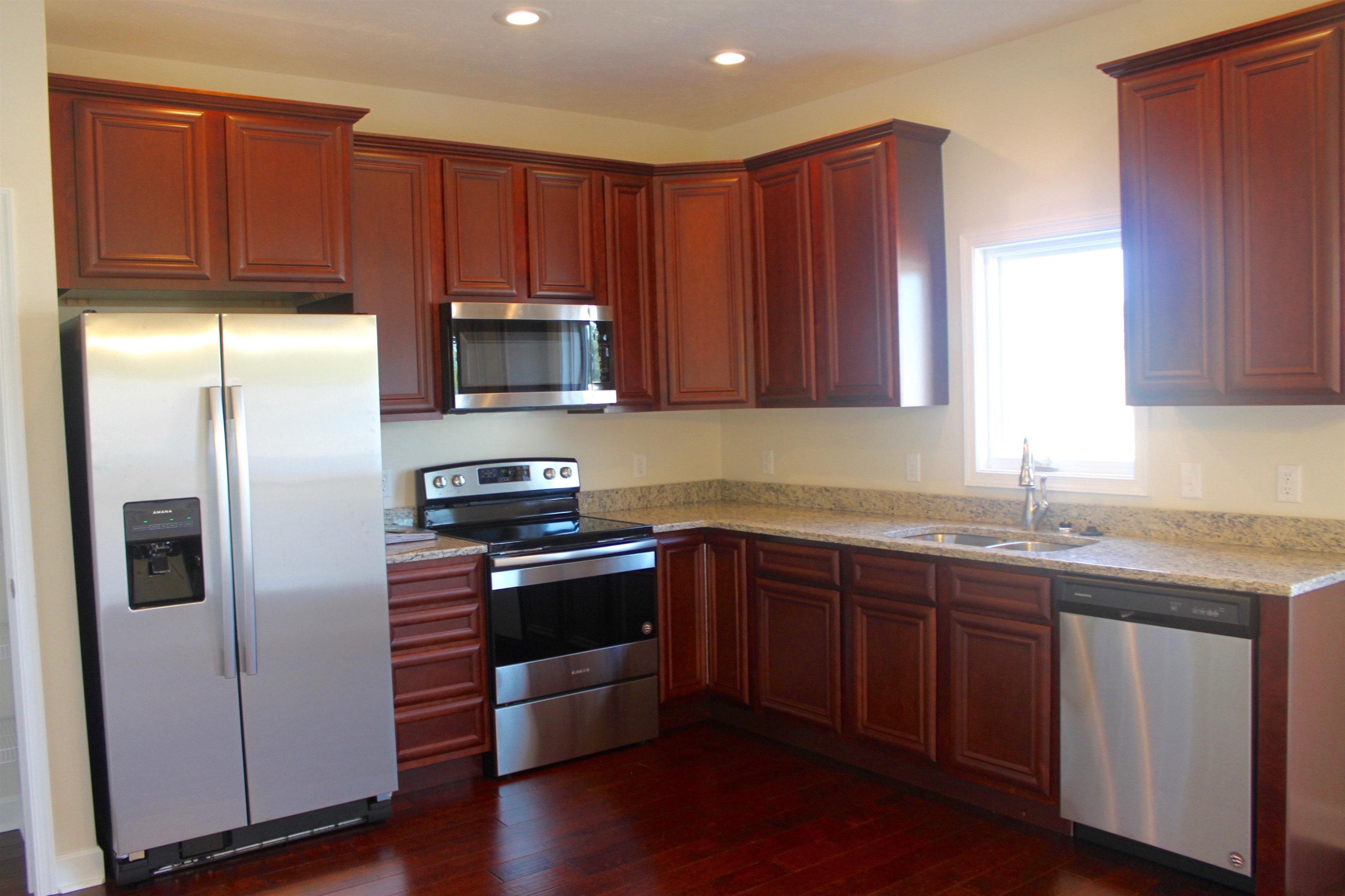 113 Cedar Point Lane Harrisonburg, VA 22802 - Photo 2 of 25 a kitchen with granite countertop wooden cabinets and stainless steel appliances