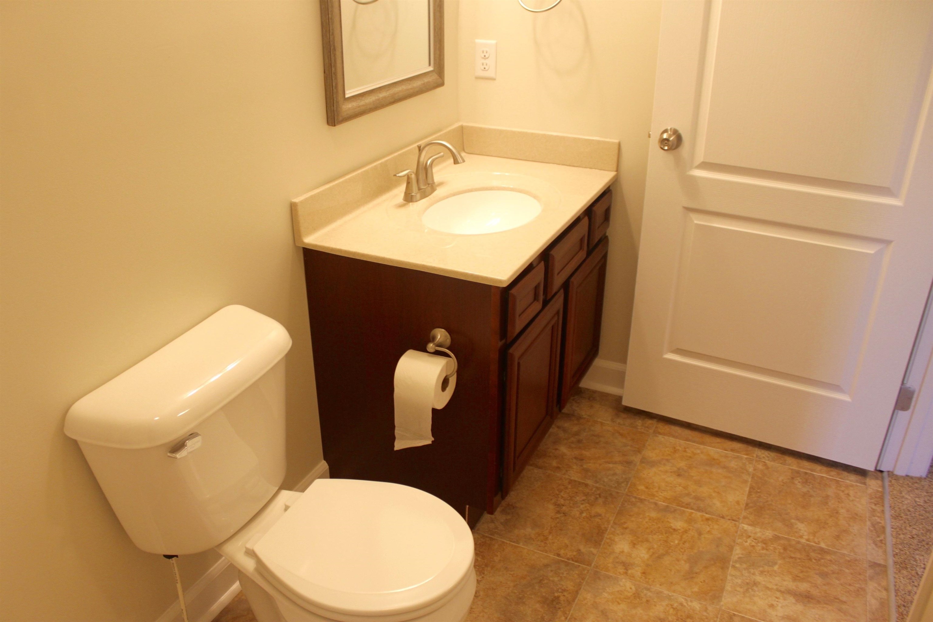 113 Cedar Point Lane Harrisonburg, VA 22802 - Photo 22 of 25 a bathroom with a sink toilet and mirror