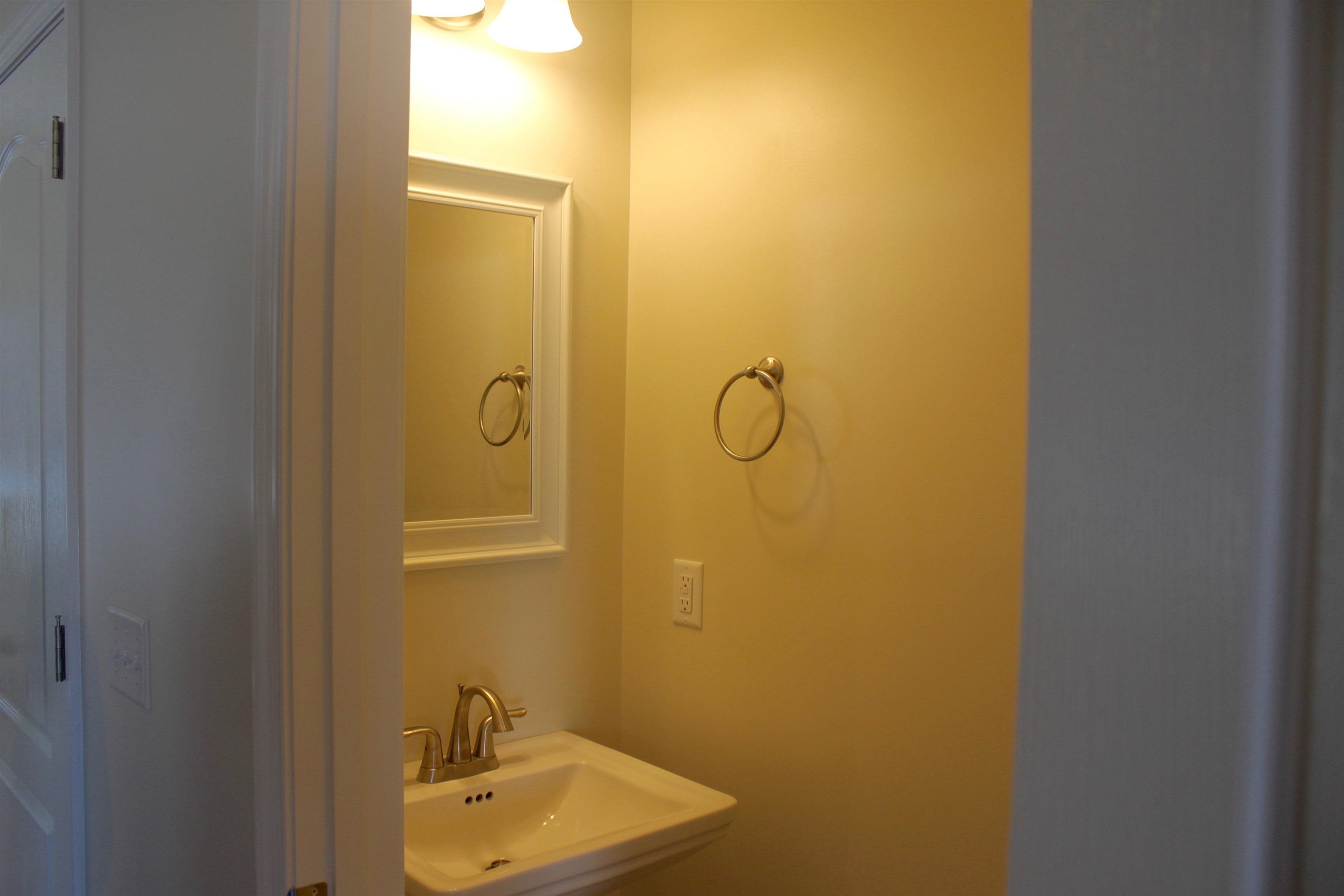 113 Cedar Point Lane Harrisonburg, VA 22802 - Photo 8 of 25 a bathroom with a sink and mirror