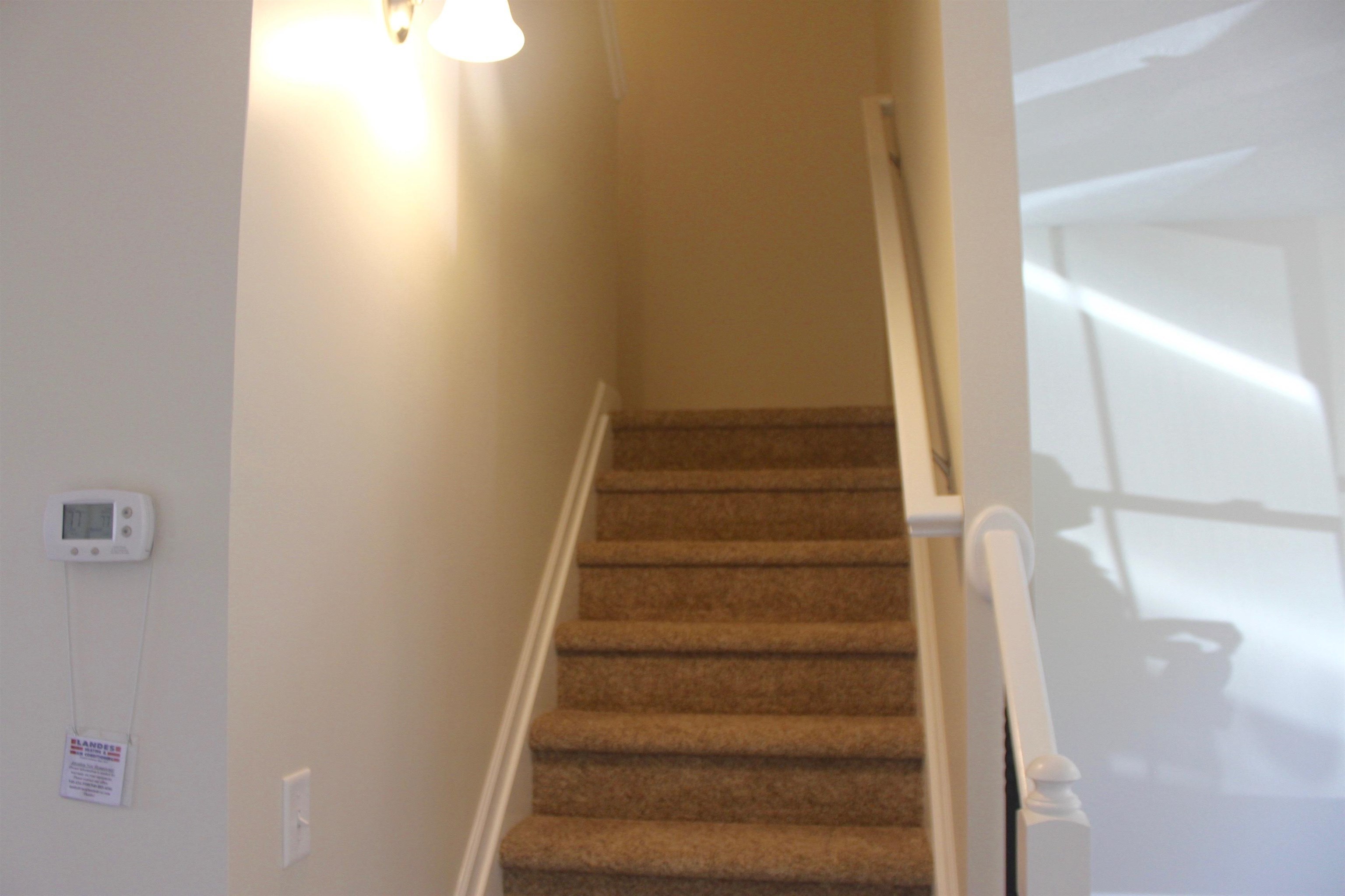 113 Cedar Point Lane Harrisonburg, VA 22802 - Photo 10 of 25 a view of staircase with white walls and white door