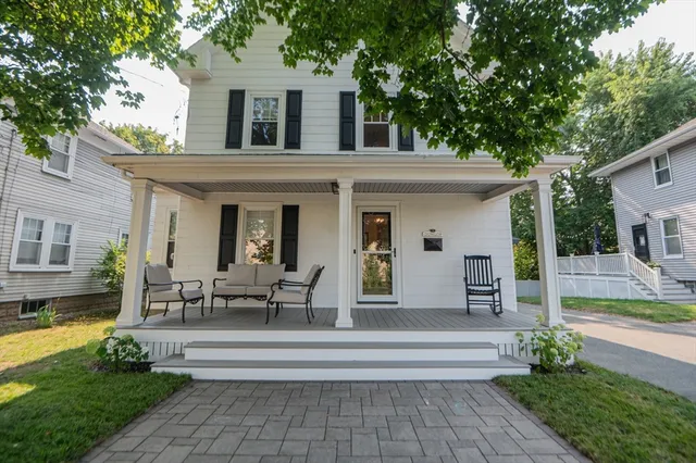 a view of a house with sitting area and a swimming pool