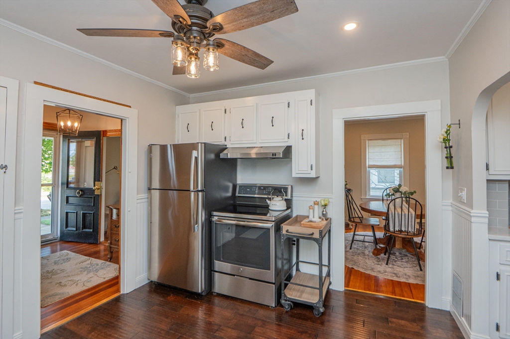 5 Florence Street Danvers, MA 01923 - Photo 14 of 41 a kitchen with stainless steel appliances a stove a refrigerator and a view of living room