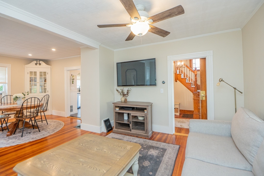 5 Florence Street Danvers, MA 01923 - Photo 23 of 41 a living room with furniture a fireplace and a flat screen tv