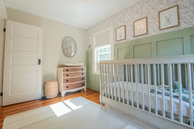 a view of a bedroom with baby crib