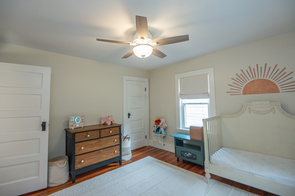 5 Florence Street Danvers, MA 01923 - Photo 38 of 41 a bedroom with furniture and a chandelier fan