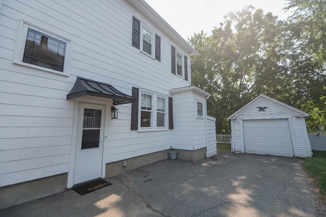 a view of a house with a yard and garage