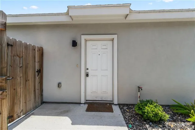 a view of a hallway with wooden shelves