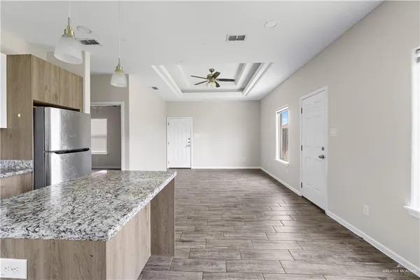 an empty room with kitchen appliances and a counter space