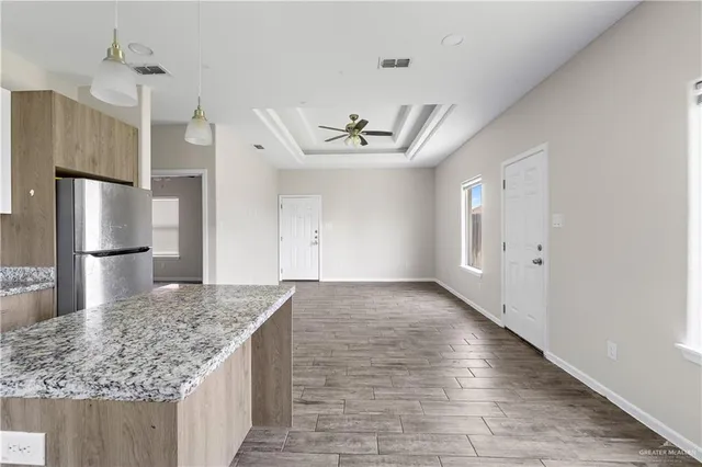 an empty room with kitchen appliances and a counter space