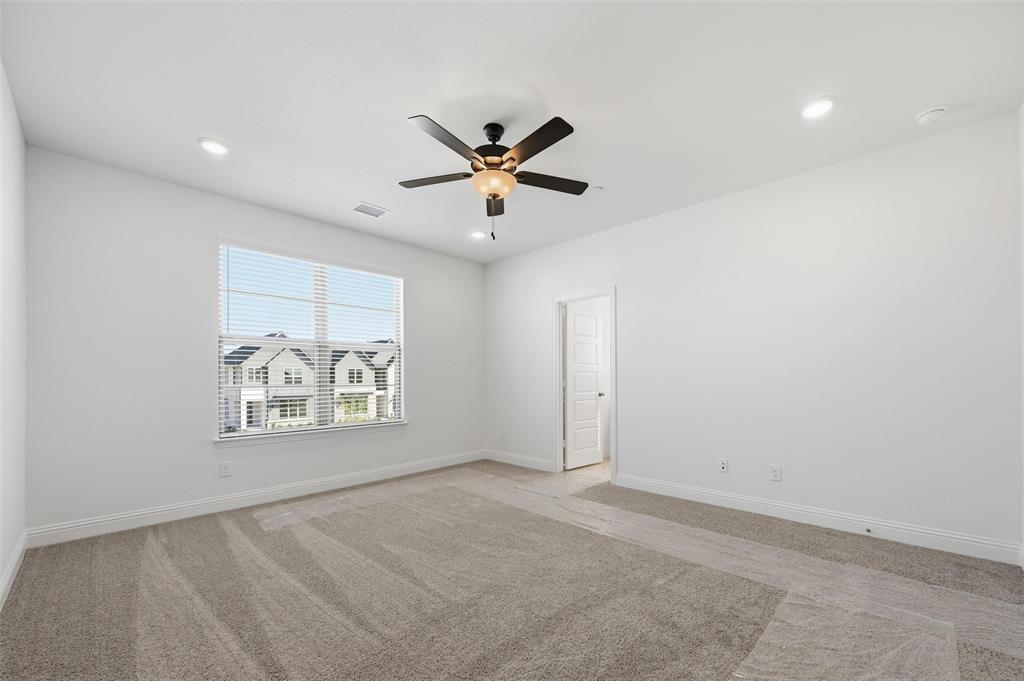 2533 Brunswick Way, Unit 2533 Allen, TX 75013 - Photo 14 of 24 an empty room with windows and fan
