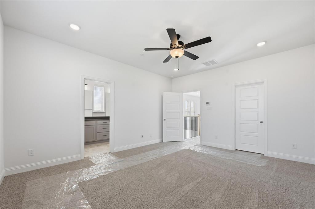 2533 Brunswick Way, Unit 2533 Allen, TX 75013 - Photo 15 of 24 a view of a livingroom with a ceiling fan & entryway