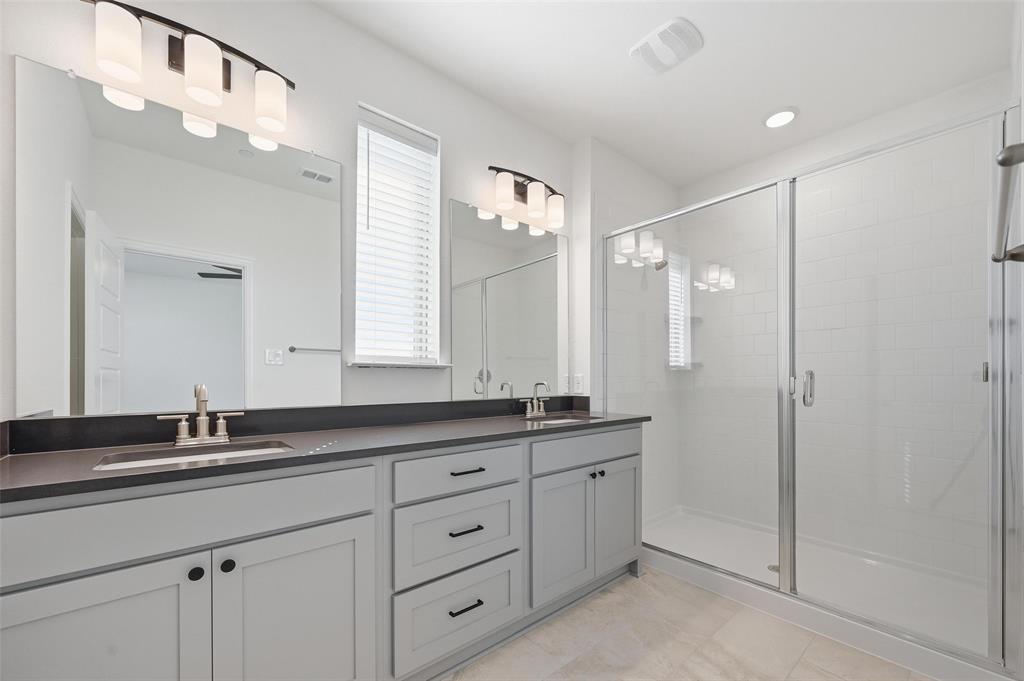 2533 Brunswick Way, Unit 2533 Allen, TX 75013 - Photo 16 of 24 a bathroom with a granite countertop sink mirror and double