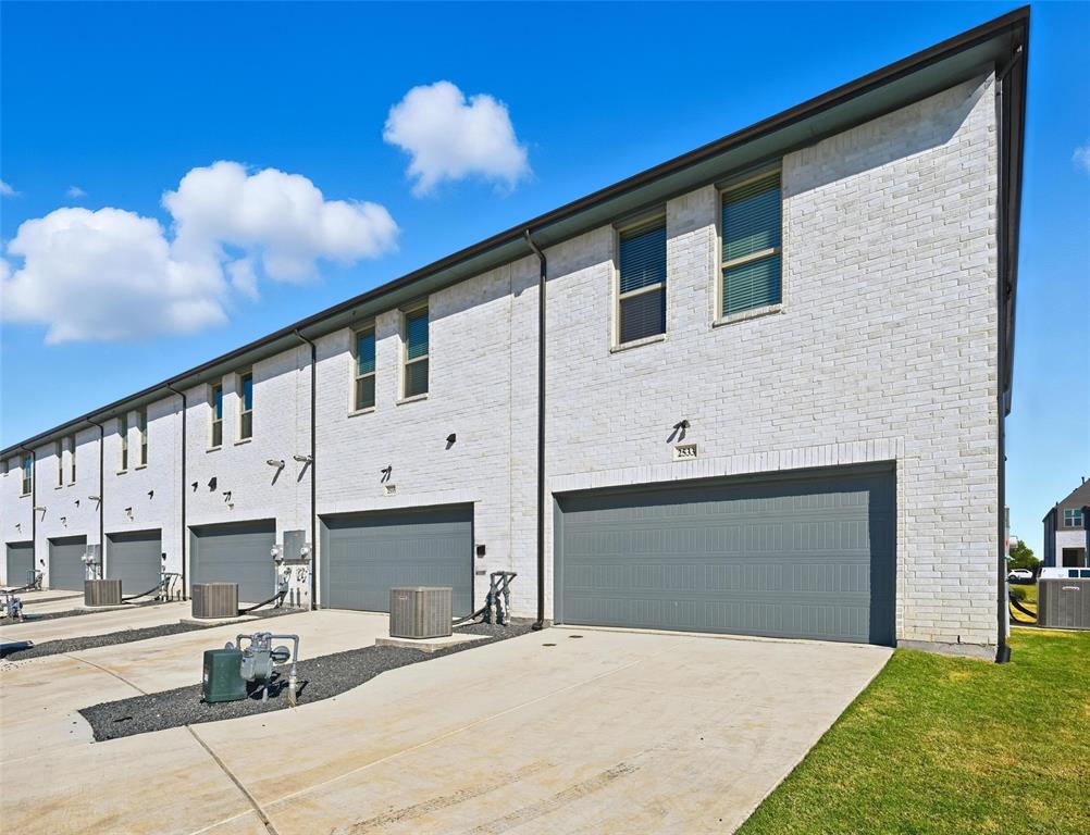 2533 Brunswick Way, Unit 2533 Allen, TX 75013 - Photo 23 of 24 a front view of a house with a yard