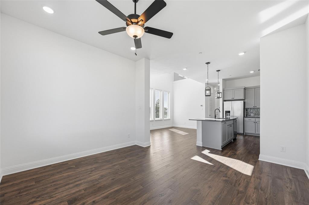 2533 Brunswick Way, Unit 2533 Allen, TX 75013 - Photo 4 of 24 a view of kitchen and empty room with wooden floor