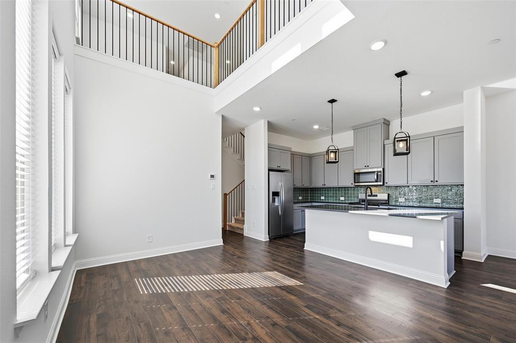 2533 Brunswick Way, Unit 2533 Allen, TX 75013 - Photo 9 of 24 a kitchen with stainless steel appliances granite countertop a refrigerator a sink and a stove