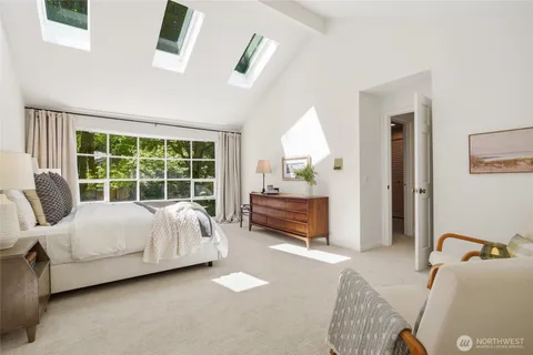 a bed room with a bed and a window