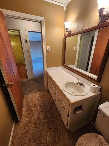 a bathroom with a tub and a toilet