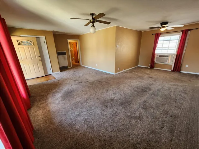 a kitchen with a sink white cabinets and stainless steel appliances