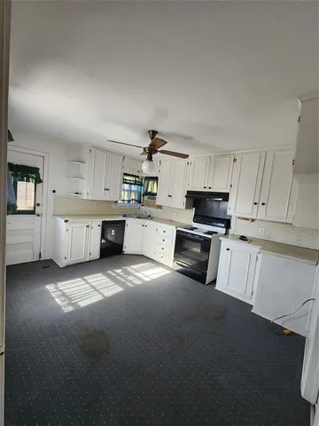 a view of a livingroom with wooden floor