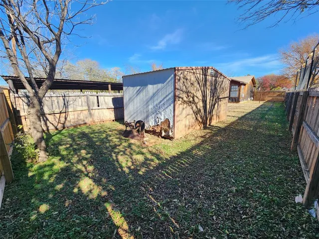 a view of backyard with green space