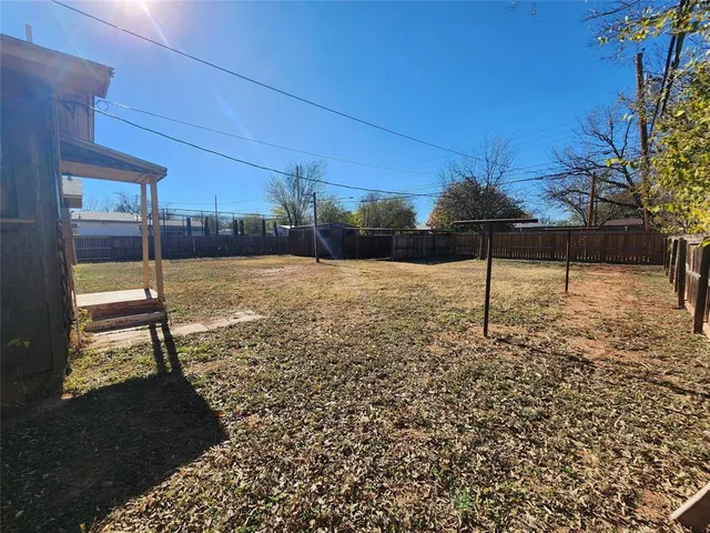 a view of front door of house with wooden floor