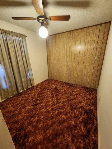 a bathroom with a sink and mirror with toilet