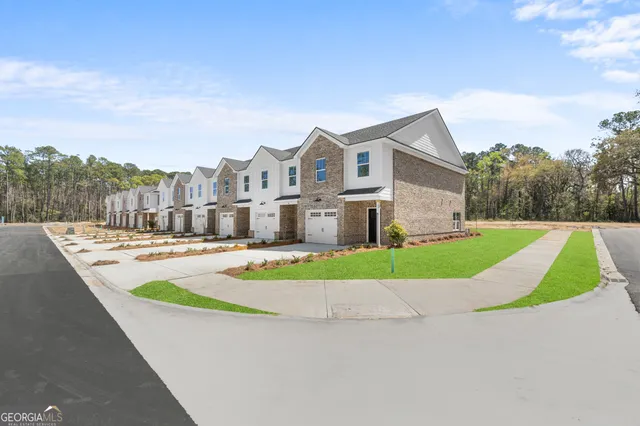a view of houses with swimming pool and yard