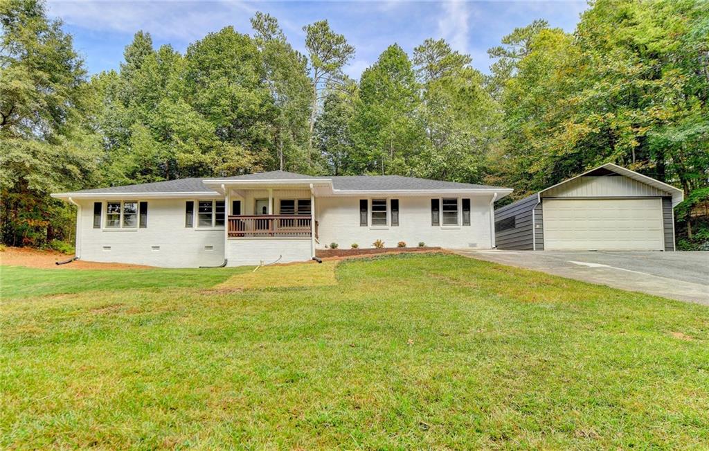 3738 Abbotts Bridge Road Duluth, GA 30096 - Photo 1 of 1 a view of a house with pool and a yard