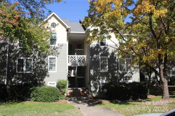 a view of house with yard