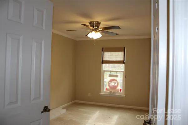a view of empty room with windows
