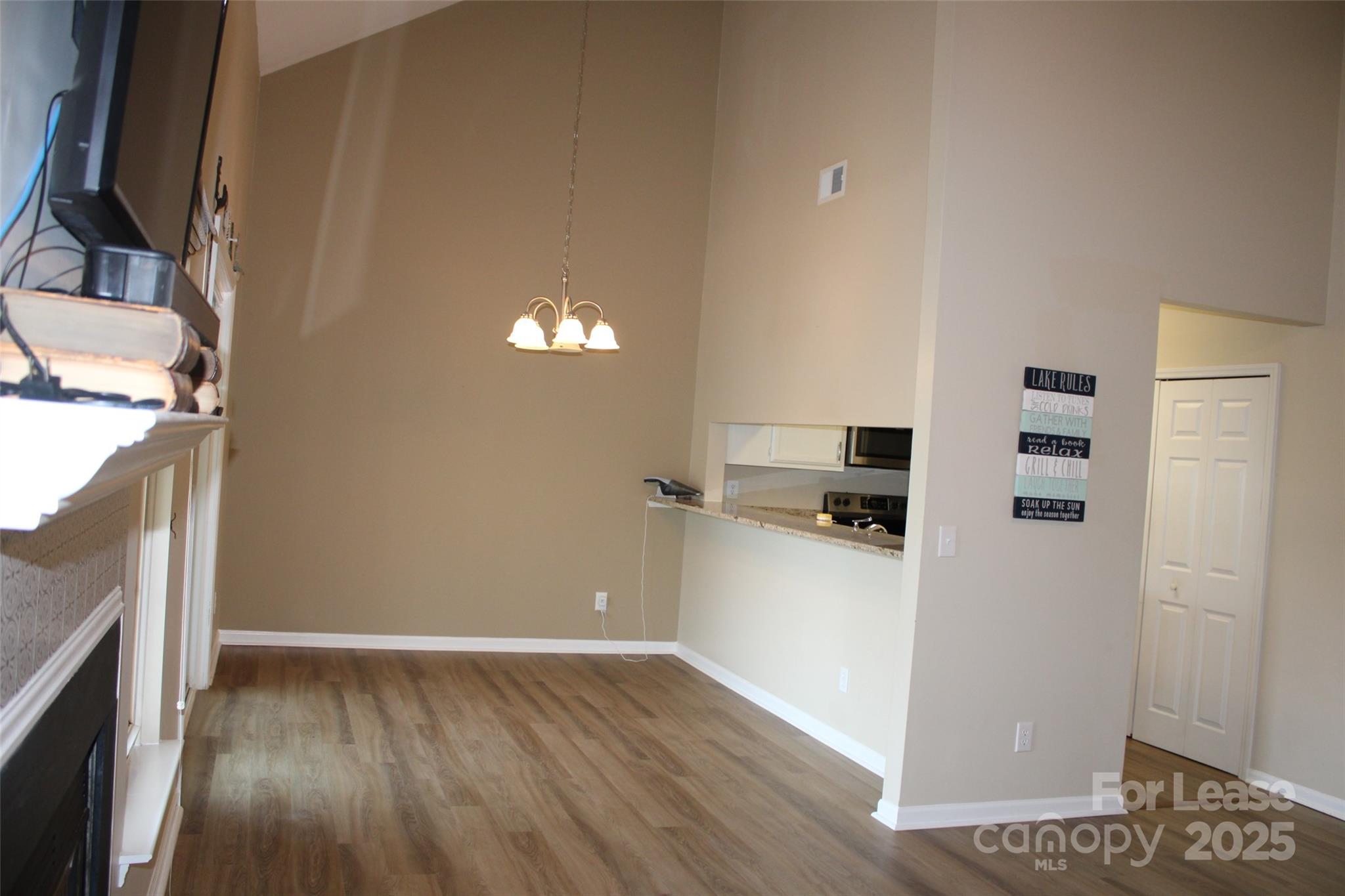 19839 Henderson Road, Unit M Cornelius, NC 28031 - Photo 10 of 23 a kitchen with a refrigerator and a stove top oven