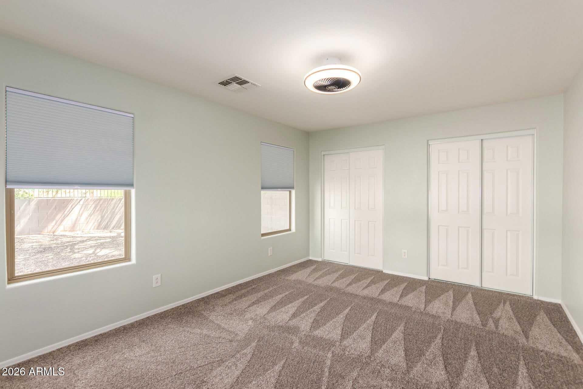 17618 West Calavar Road Surprise, AZ 85388 - Photo 13 of 24 a view of empty room with window