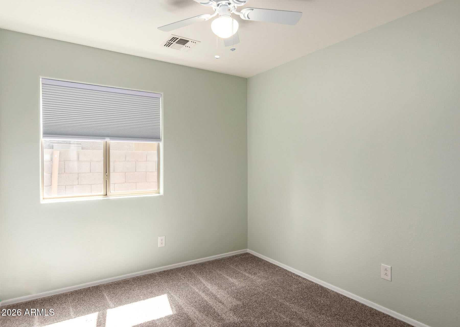 17618 West Calavar Road Surprise, AZ 85388 - Photo 17 of 24 an empty room with a window