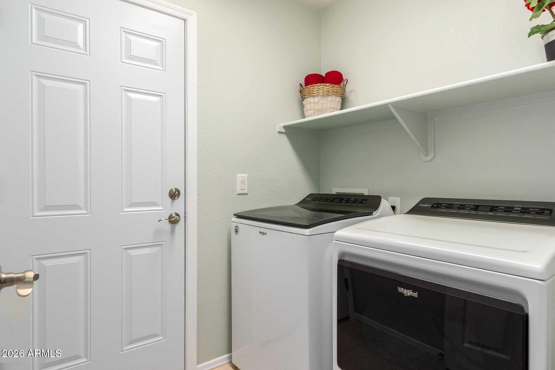 17618 West Calavar Road Surprise, AZ 85388 - Photo 20 of 24 a utility room with dryer and washer