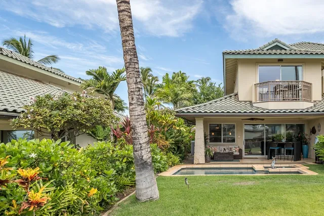 a house with swimming pool in front of it