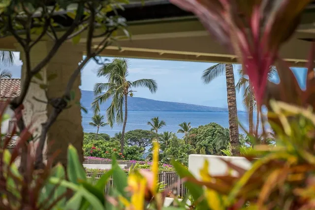 a kitchen with stainless steel appliances granite countertop a sink and a refrigerator