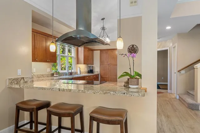 a kitchen with granite countertop a sink and a window