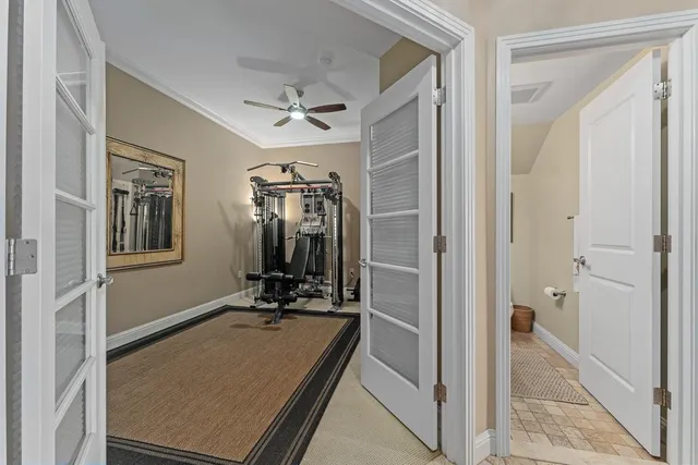 a bathroom with a granite countertop sink mirror vanity and toilet
