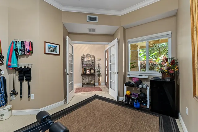 a bedroom with a bed couch and window