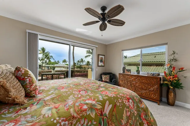a view of a balcony with furniture and a potted plant